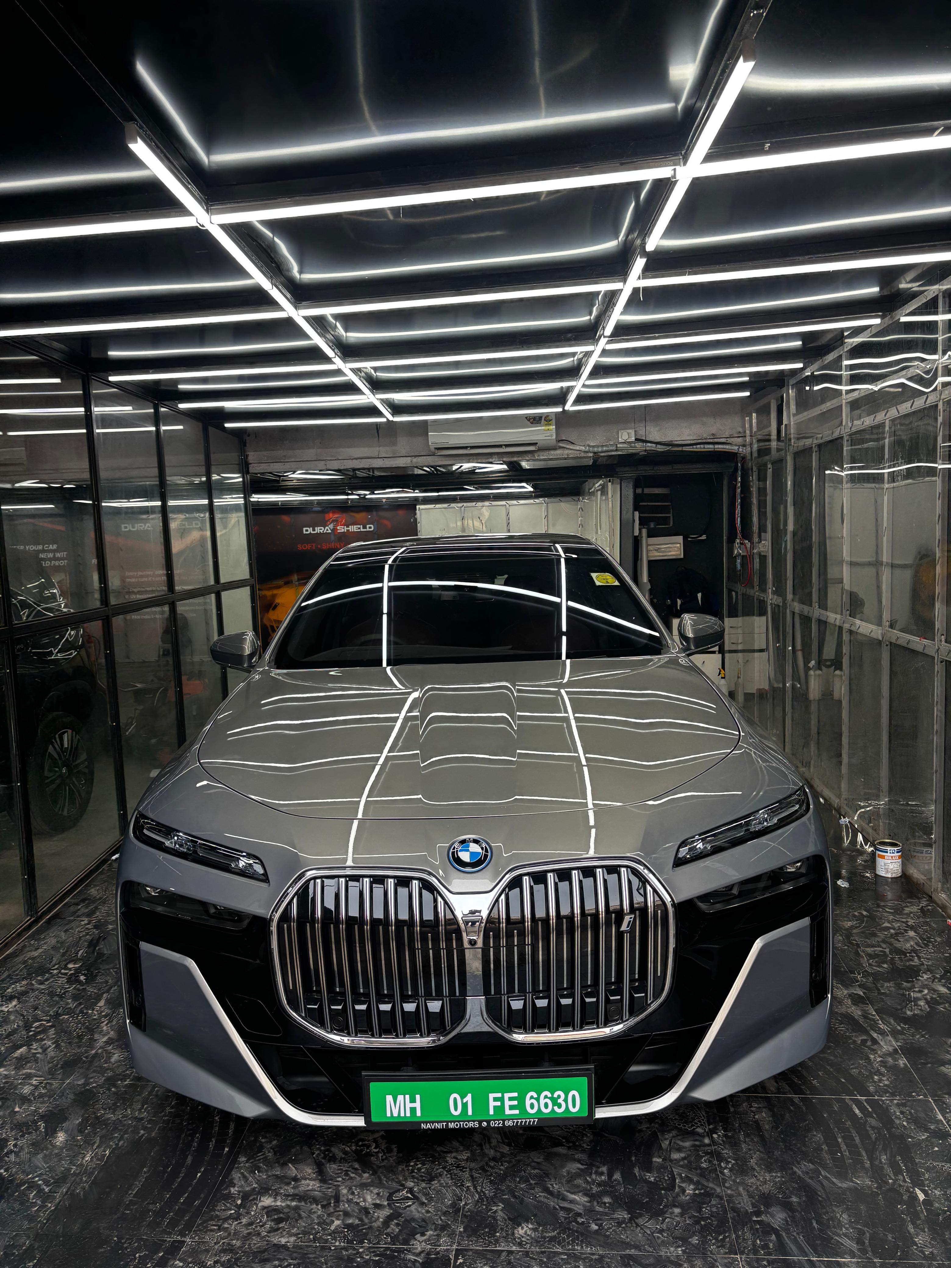 Car after paint protection film showing high-gloss protected surface.