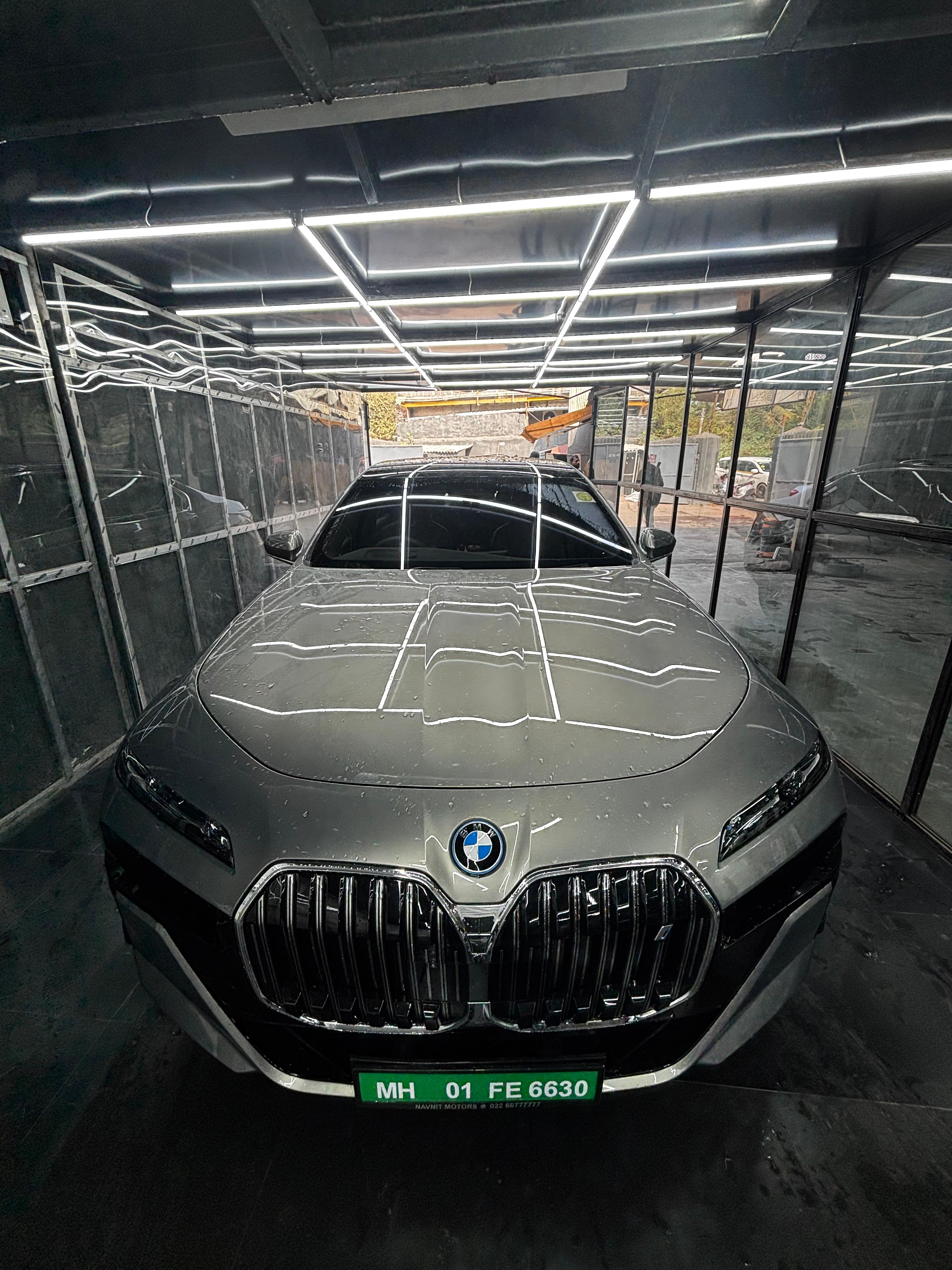 Car before paint protection film showing clear unprotected surface.